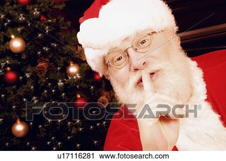 Santa Claus with finger to lips View Large Photo Image Stock Image - Santa Claus with finger to lips. Fotosearch