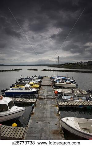 Stock Photo - Scotland; Row of boats anchored at marina. Fotosearch