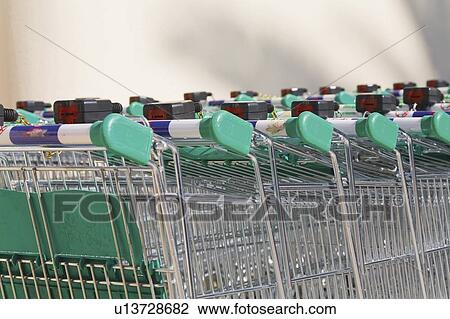 Shopping carts; Rows of shopping trolleys outside supermarket View Large Photo Image Stock Image - Shopping carts; Rows of shopping trolleys outside supermarket. Fotosearch