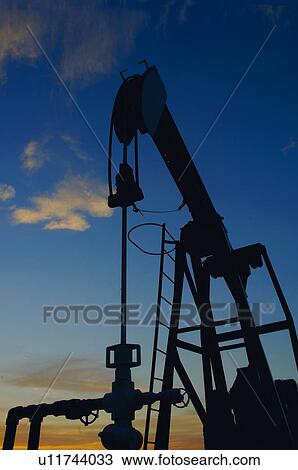 Silhouette of oil pump View Large Photo Image Stock Image - Silhouette of oil pump. Fotosearch