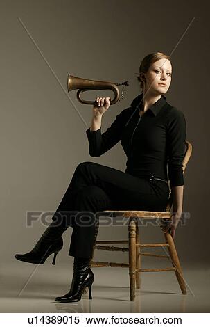 Stock Photography - Sitting trumpet player. Fotosearch