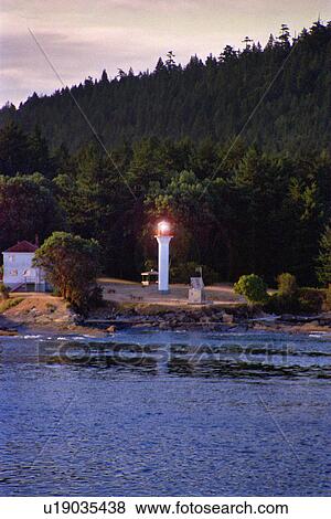 Small lighthouse on shore View Large Photo Image Stock Photo - Small lighthouse on shore. Fotosearch