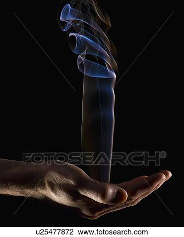 Smoke rising from a hand View Large Photo Image Stock Image - Smoke rising from a hand. Fotosearch