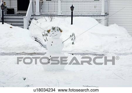 Picture - Snowman in a front yard. Fotosearch