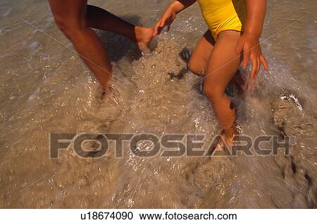 Stock Image - Stirring up sand. Fotosearch