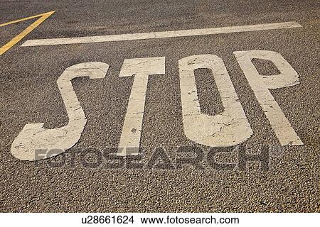 Picture - Stop painted on road . Fotosearch