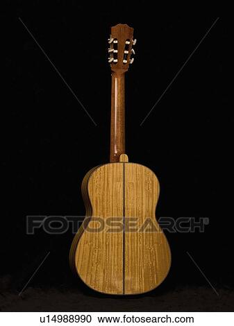 Stock Image - Studio shot of an acoustic guitar. Fotosearch