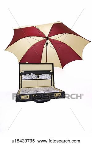 Stock Photography - Suitcase full of money with umbrella. Fotosearch