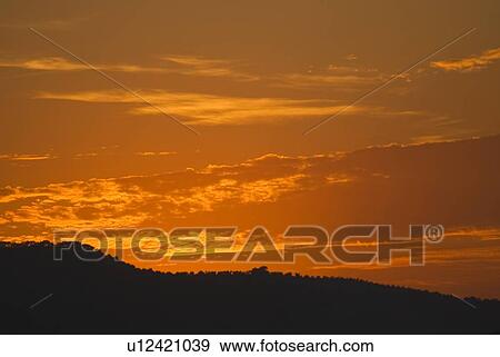 Sunset over landscape View Large Photo Image Stock Photo - Sunset over landscape. Fotosearch