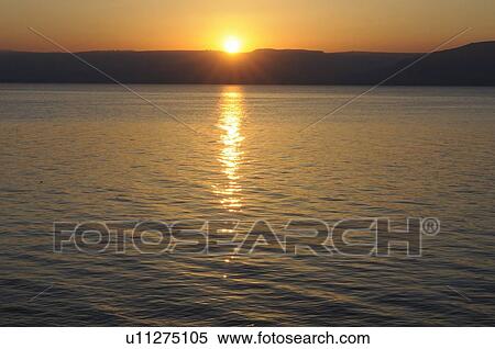 Stock Photography - Sunset over water. Fotosearch