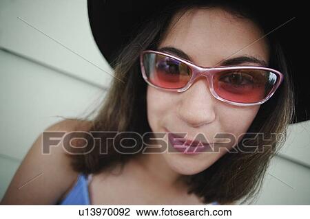Stock Image - Teenager with sunglasses. Fotosearch