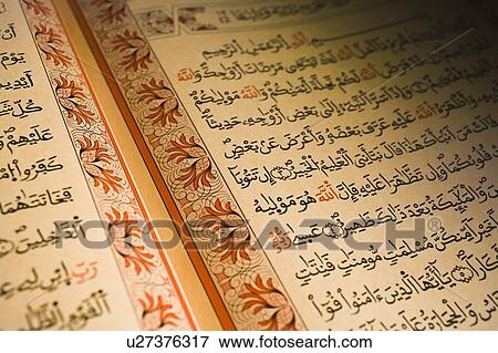 Stock Photo - The Quran; Arabic writing in the holy book of Islam. Fotosearch