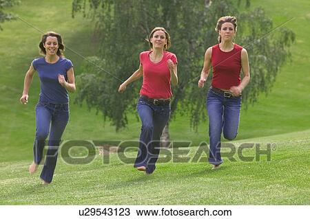 Three teen girls running in park View Large Photo Image Stock Image - Three teen girls running in park. Fotosearch