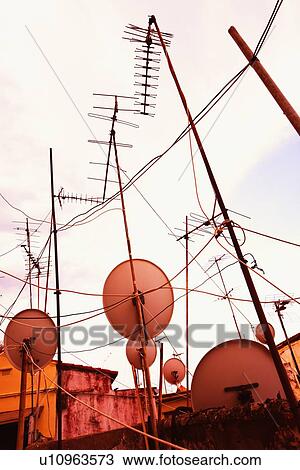 TV aerials and satellite dishes; TV aerials and satellite dishes View Large Photo Image Stock Image - TV aerials and satellite dishes; TV aerials and satellite dishes. Fotosearch