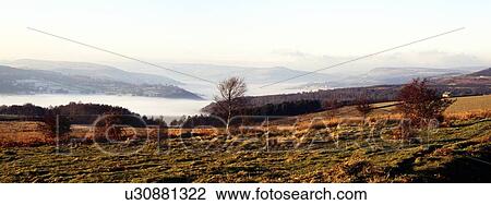 View across fields to a mist covered valley View Large Photo Image Stock Image - View across fields to a mist covered valley. Fotosearch
