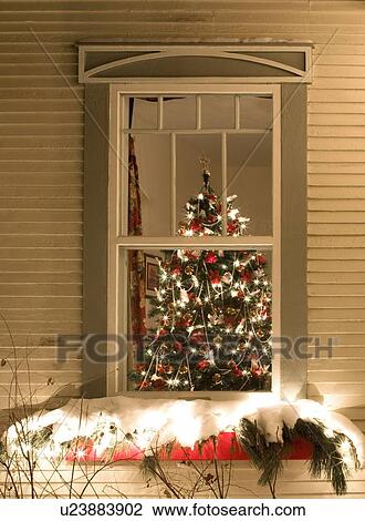 View through a window of a Christmas tree covered in decorations and lights View Large Photo Image Stock Image - View through a window of a Christmas tree covered in decorations and lights. Fotosearch
