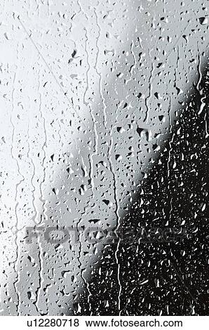 Stock Photo - Water drops on a window. Fotosearch