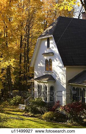 Stock Photo - Waterloo, Quebec, Canada; House in autumn. Fotosearch