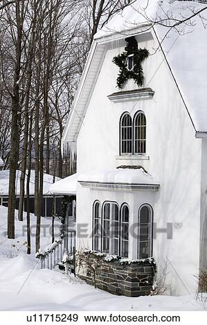 Stock Photo - Waterloo, Quebec, Canada; House in winter. Fotosearch