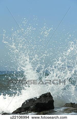 Waves breaking on rocks View Large Photo Image Picture - Waves breaking on rocks. Fotosearch