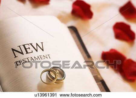 Wedding rings on the New Testament Bible View Large Photo Image Stock Image - Wedding rings on the New Testament Bible. Fotosearch