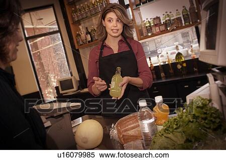 Woman behind the counter View Large Photo Image Stock Photography - Woman behind the counter. Fotosearch