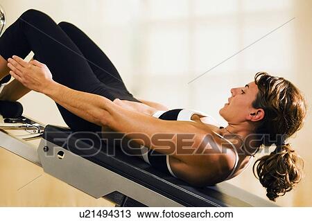 Stock Image - Woman doing abdominal exercises . Fotosearch