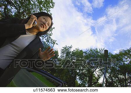 Woman has stressful conversation View Large Photo Image Stock Image - Woman has stressful conversation. Fotosearch