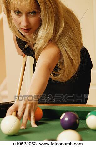 Stock Image - Woman playing pool. Fotosearch