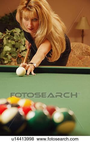 Stock Photo - Woman playing pool. Fotosearch