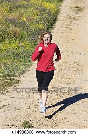 Woman running View Large Photo Image Stock Photo - Woman running. Fotosearch