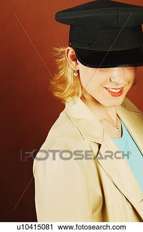Woman wearing a hat View Large Photo Image Stock Image - Woman wearing a hat. Fotosearch