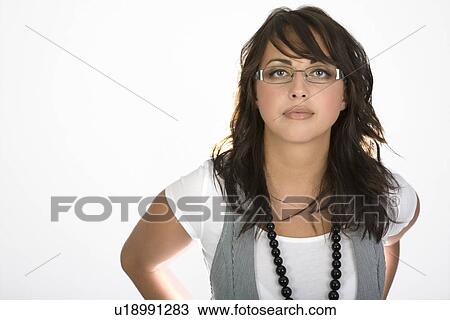 Stock Image - Woman wearing glasses and a vest. Fotosearch
