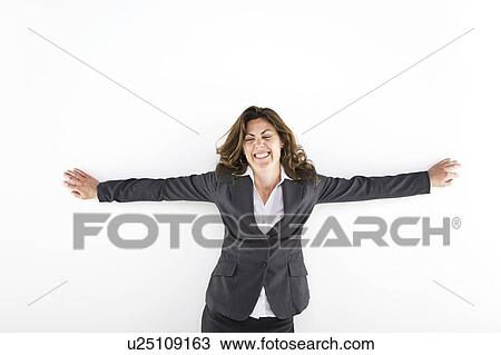 Stock Image - Woman with her arms raised. Fotosearch