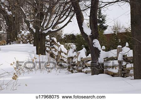 Wooden fence covered in snow View Large Photo Image Stock Photography - Wooden fence covered in snow. Fotosearch