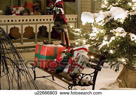Wrapped presents sitting on a park bench outside View Large Photo Image Stock Image - Wrapped presents sitting on a park bench outside. Fotosearch