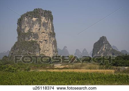 Picture - Yangshuo county, China, Asia; Karst peaks and rice fields. Fotosearch