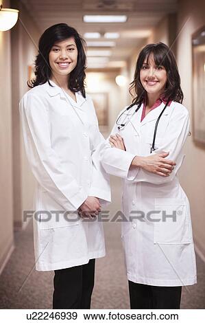 2 Females Doctors smiling View Large Photo Image Stock Photo - 2 Females Doctors smiling. Fotosearch