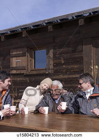 4 people laughing holding cups View Large Photo Image Stock Image - 4 people laughing holding cups. Fotosearch