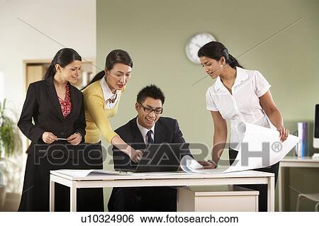 A business group discuss some plans. View Large Photo Image Stock Photograph - A business group discuss some plans.. Fotosearch