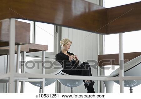 A business woman having a coffee View Large Photo Image Stock Image - A business woman having a coffee. Fotosearch