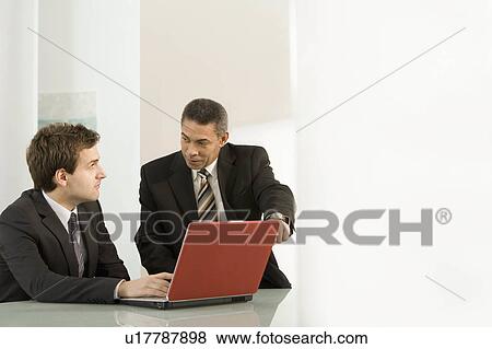 A businessman mentoring View Large Photo Image Stock Photo - A businessman mentoring. Fotosearch