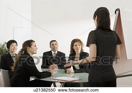 A businesswoman giving a presentation View Large Photo Image Stock Image - A businesswoman giving a presentation. Fotosearch