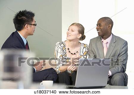 A casual business meeting View Large Photo Image Stock Image - A casual business meeting. Fotosearch