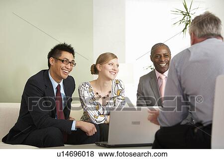 A casual business meeting View Large Photo Image Stock Photo - A casual business meeting. Fotosearch