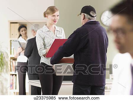 A delivery arrives at an office View Large Photo Image Stock Photography - A delivery arrives at an office. Fotosearch