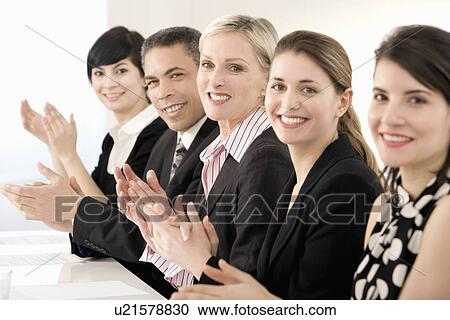 Stock Image - A line of business people clapping. Fotosearch