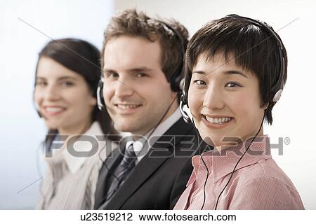 Stock Image - A line of telephone operators. Fotosearch
