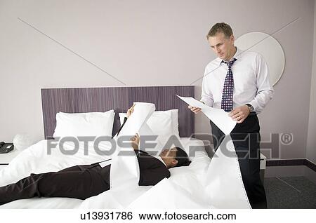 A male and female reading computer paper View Large Photo Image Stock Photograph - A male and female reading computer paper. Fotosearch