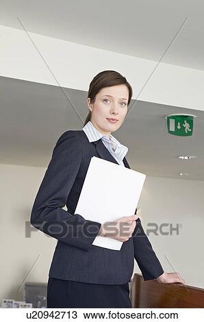 Stock Image - A portrait of a female receptionist. Fotosearch